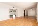 Open-concept living area with hardwood floors and seamless flow to the kitchen at 5320 W Maui Ln, Glendale, AZ 85306