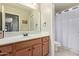 Bathroom featuring a vanity, mirror, and a shower/tub combo at 6002 N 124Th Dr, Litchfield Park, AZ 85340
