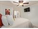 Inviting bedroom featuring ceiling fan, soft lighting, modern TV and neutral walls at 6002 N 124Th Dr, Litchfield Park, AZ 85340