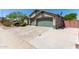 This charming home features a well-manicured yard, three-car garage, and a convenient corner lot location at 6002 N 124Th Dr, Litchfield Park, AZ 85340