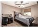 Bedroom with a full bed, desk, and a window offering natural light at 605 S Monterey St, Gilbert, AZ 85233