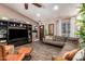 Inviting living room with comfortable seating, wood-look flooring, and ample natural light, perfect for relaxation at 605 S Monterey St, Gilbert, AZ 85233
