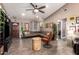 Stylish living room with vaulted ceiling, wood-look tile flooring, and modern furnishings, creating a cozy ambiance at 605 S Monterey St, Gilbert, AZ 85233