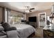 Serene main bedroom with plush carpeting, ample natural light, and en-suite bathroom access, offering a private retreat at 605 S Monterey St, Gilbert, AZ 85233