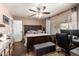 Spacious main bedroom with a large bed, accent chair, and a window offering natural light at 605 S Monterey St, Gilbert, AZ 85233