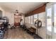 Enclosed patio featuring workout equipment, a red bicycle, and natural light from the surrounding windows at 605 S Monterey St, Gilbert, AZ 85233