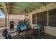 Beautiful covered patio featuring comfortable seating and an outdoor cooking area at 605 S Monterey St, Gilbert, AZ 85233