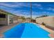Backyard pool area with a well-maintained pool, privacy walls, and a serene atmosphere at 605 S Monterey St, Gilbert, AZ 85233