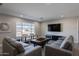 Bright living room featuring modern sofas, a large window, and a view of the neighborhood at 6413 E Parkview Dr, Scottsdale, AZ 85257