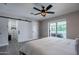 This main bedroom features sliding door access to the back yard and stylish decor at 6413 E Parkview Dr, Scottsdale, AZ 85257