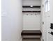 Mud room with convenient wall hooks, floating shelves, and a bench for storage and organization at 6413 E Parkview Dr, Scottsdale, AZ 85257