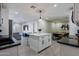 Spacious open floor plan with a kitchen island, dining area, and cozy living room at 6413 E Parkview Dr, Scottsdale, AZ 85257