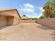 The backyard of this property features gravel, a block wall, and a covered patio at 7037 W Cavalier Dr, Glendale, AZ 85303