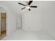 Spacious bedroom with fan and multiple doorways and large window at 7037 W Cavalier Dr, Glendale, AZ 85303