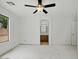 The bedroom opens to a bathroom vanity, with a backyard view from window at 7037 W Cavalier Dr, Glendale, AZ 85303