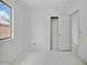 Bedroom features a door to hall, window providing natural light at 7037 W Cavalier Dr, Glendale, AZ 85303