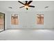 Bright and airy living room featuring neutral tones, ceiling fan, and lots of natural light at 7037 W Cavalier Dr, Glendale, AZ 85303