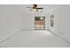 Spacious living room with sliding door and ceiling fan at 7037 W Cavalier Dr, Glendale, AZ 85303