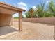This home has a covered patio area looking out to the backyard with a block wall at 7037 W Cavalier Dr, Glendale, AZ 85303