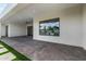 Modern backyard with large windows, covered patio and desert landscaping at 8549 E Indianola Ave, Scottsdale, AZ 85251