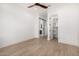 Bright bedroom showcases hardwood floors, en suite bath and walk-in closet at 8549 E Indianola Ave, Scottsdale, AZ 85251