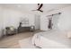 Spacious bedroom features modern decor, ceiling fan, and a sliding barn door at 8549 E Indianola Ave, Scottsdale, AZ 85251