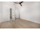 Spacious bedroom features hardwood floors, ensuite bathroom, and walk-in closet at 8549 E Indianola Ave, Scottsdale, AZ 85251
