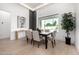 Bright dining room with modern lighting, decor, and backyard views at 8549 E Indianola Ave, Scottsdale, AZ 85251