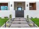 Inviting entrance featuring landscaped steps, decorative lighting, and modern design elements at 8549 E Indianola Ave, Scottsdale, AZ 85251
