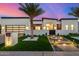 Stunning modern home with a landscaped front yard, walkway lighting, and a gated entrance at 8549 E Indianola Ave, Scottsdale, AZ 85251