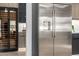 Modern kitchen featuring stainless steel refrigerator and adjacent wine fridge at 8549 E Indianola Ave, Scottsdale, AZ 85251