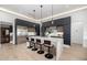 Modern kitchen with large island, sleek cabinetry, pendant lighting, and stainless steel appliances at 8549 E Indianola Ave, Scottsdale, AZ 85251