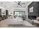 Bright living room with a fireplace and modern furnishings flows to outdoor pool area at 8549 E Indianola Ave, Scottsdale, AZ 85251