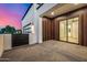 Modern home features an outdoor living space, wood accent wall, and sliding glass doors at 8549 E Indianola Ave, Scottsdale, AZ 85251