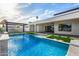Spectacular backyard with an inviting pool, outdoor kitchen, and stylish patio area perfect for entertaining at 8549 E Indianola Ave, Scottsdale, AZ 85251