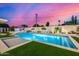 Backyard swimming pool with water features, turf and lush landscaping at 8549 E Indianola Ave, Scottsdale, AZ 85251