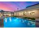 Backyard swimming pool with turf and outdoor kitchen and modern design elements at 8549 E Indianola Ave, Scottsdale, AZ 85251