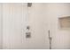 Modern shower features white tiled walls, brushed nickel fixtures, and a built-in niche at 8549 E Indianola Ave, Scottsdale, AZ 85251
