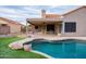 This inviting backyard has a private pool and covered patio for relaxation and entertainment at 8635 W Country Gables Dr, Peoria, AZ 85381
