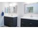 Double vanity bathroom with framed mirrors and updated fixtures, offering space and style at 8635 W Country Gables Dr, Peoria, AZ 85381