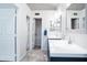 Bathroom showcases dual vanities, modern fixtures, and a connecting doorway, enhancing the functional space at 8635 W Country Gables Dr, Peoria, AZ 85381