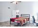 Well-designed bedroom includes a bed, a workstation, and a glimpse into the adjacent bathroom for convenience at 8635 W Country Gables Dr, Peoria, AZ 85381