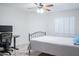 Bedroom featuring plantation shutters, a ceiling fan, and neutral colors at 8635 W Country Gables Dr, Peoria, AZ 85381