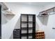 Organized closet space featuring hanging racks, shelving, and storage bins offers ample space at 8635 W Country Gables Dr, Peoria, AZ 85381