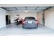 Large garage features built-in cabinets and ample space for vehicles and storage at 8635 W Country Gables Dr, Peoria, AZ 85381