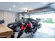 Spacious garage with storage cabinets, accommodating multiple vehicles and equipment at 8635 W Country Gables Dr, Peoria, AZ 85381