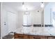 Eat-in kitchen with white granite countertops, wooden cabinets, and pendant lighting at 8635 W Country Gables Dr, Peoria, AZ 85381