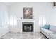 Living room with fireplace, white plantation shutters, and neutral decor for a bright and airy feel at 8635 W Country Gables Dr, Peoria, AZ 85381