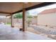 Covered patio with tiled flooring, supported by columns, provides a relaxing outdoor space at 8635 W Country Gables Dr, Peoria, AZ 85381