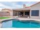 Backyard pool with a covered patio and landscaped surroundings provides a relaxing outdoor space at 8635 W Country Gables Dr, Peoria, AZ 85381
